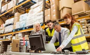 Warehouse managers and worker talking in a large warehouse-1